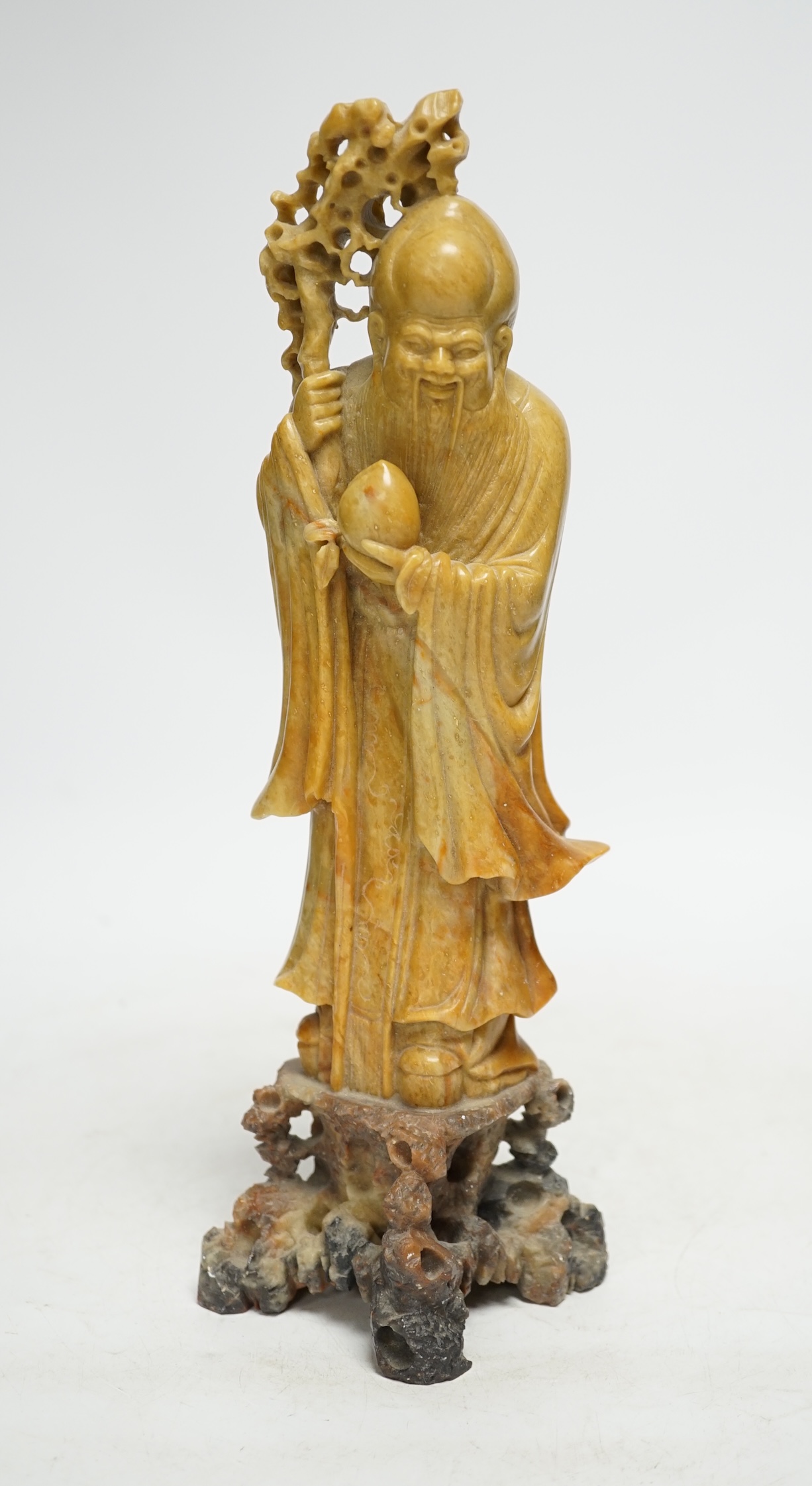 A Chinese soapstone standing figure of Shou Lao, 30cm. Condition - good.
